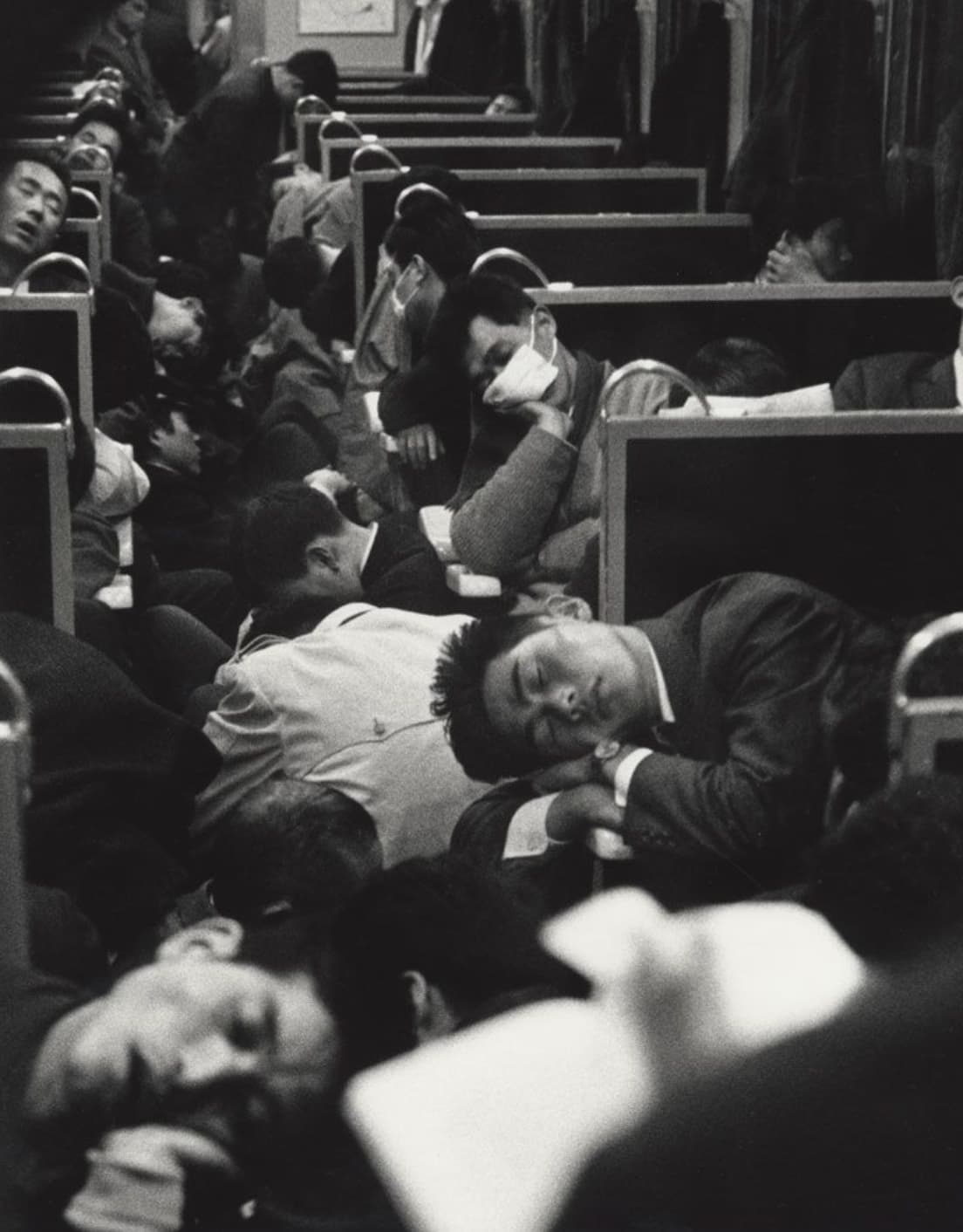 people sleeping on a train